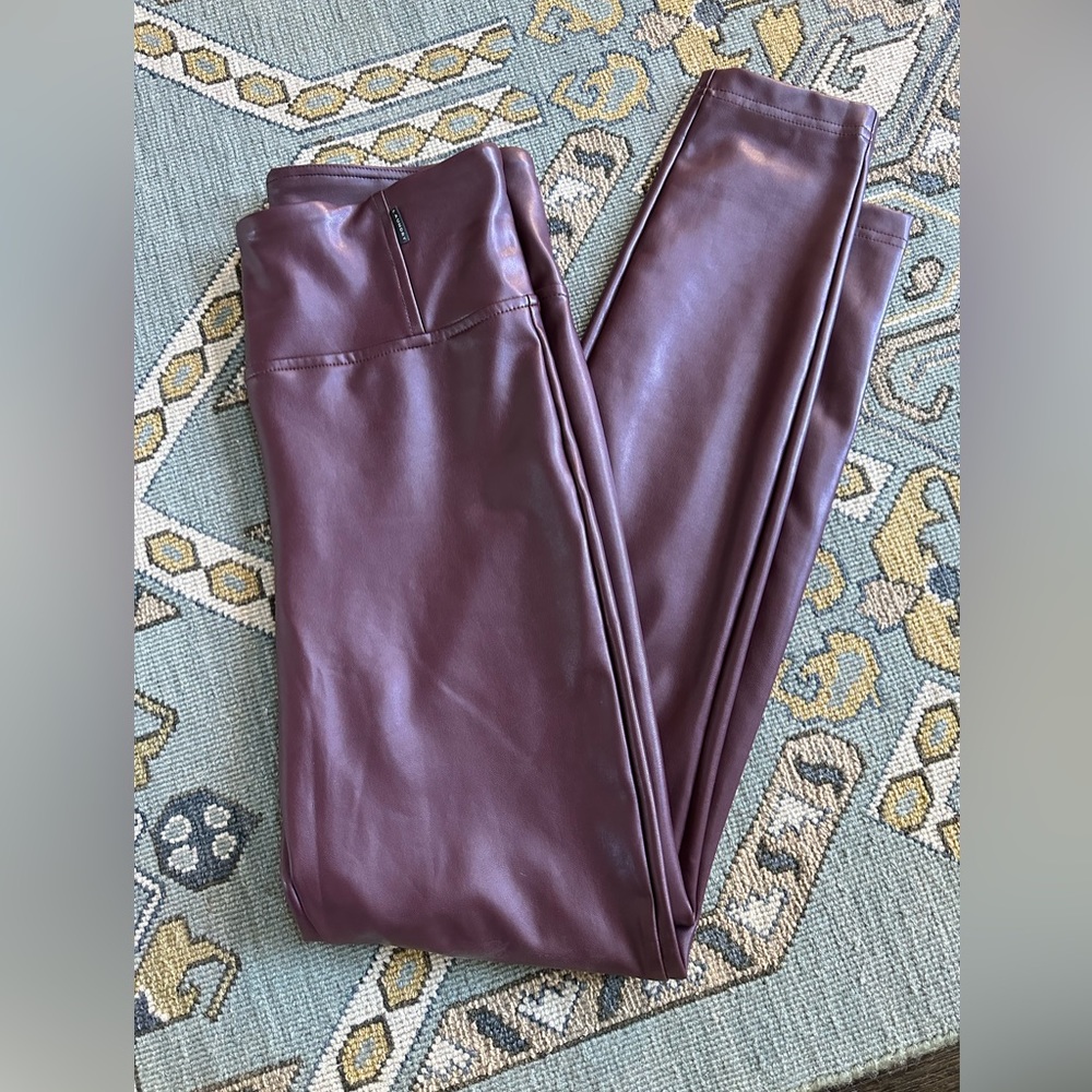 Faux leather burgundy leggings. They have a soft lining. Very comfortable!